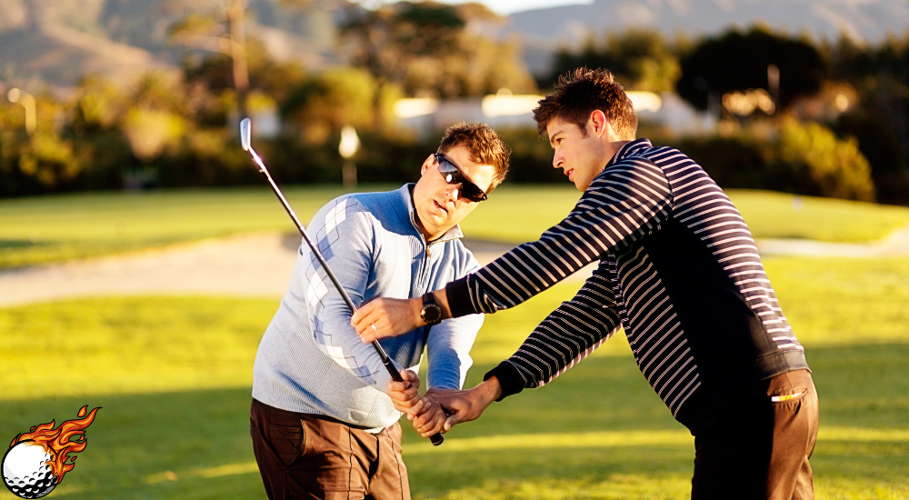 a person is teaching another person how to play golf  