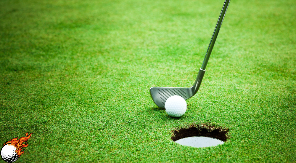 golf bat and ball in the ground